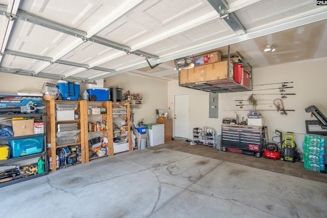 532 Ariel Cir, Lexington, SC 29072 - garage featuring electric panel, a workshop area, and a garage door opener
