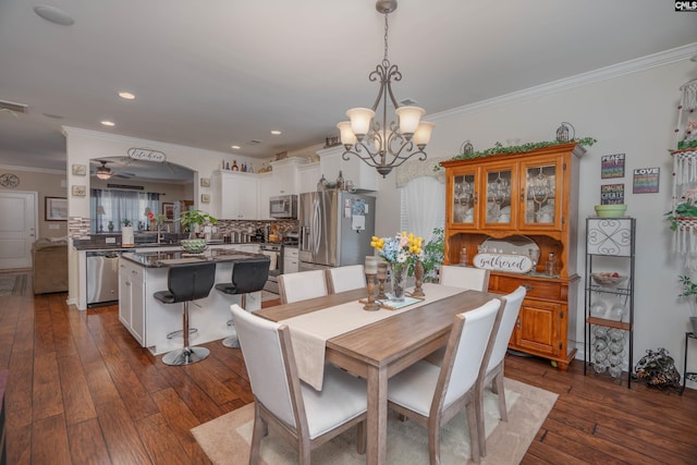 532 Ariel Cir, Lexington, SC 29072 - dining space featuring crown molding, dark wood-type flooring, a chandelier, ceiling fan, and recessed lighting