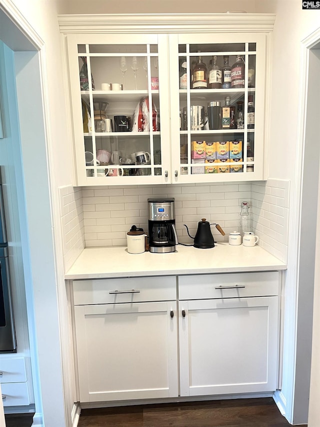 1324 Tamarind Ln, Chapin, SC 29036 - bar area featuring tasteful backsplash and dark wood-type flooring