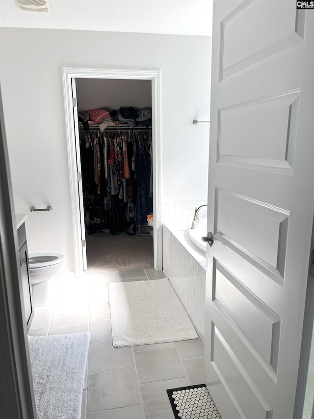 1324 Tamarind Ln, Chapin, SC 29036 - full bath with a garden tub, tile patterned floors, a walk in closet, and vanity