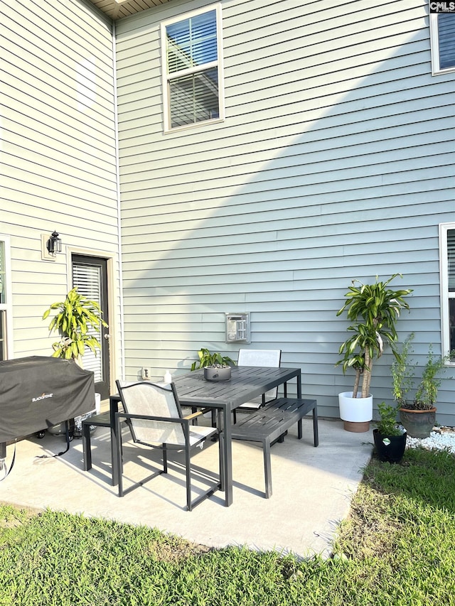 1324 Tamarind Ln, Chapin, SC 29036 - view of patio featuring a grill and outdoor dining area