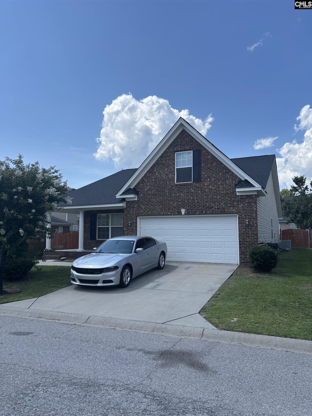 117 Parkstone Way W, Columbia, SC 29170 - view of front of house featuring brick siding, driveway, and a garage