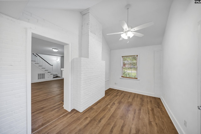 1005 D Ave, West Columbia, SC 29169 - empty room with vaulted ceiling, wood finished floors, ceiling fan, and stairway