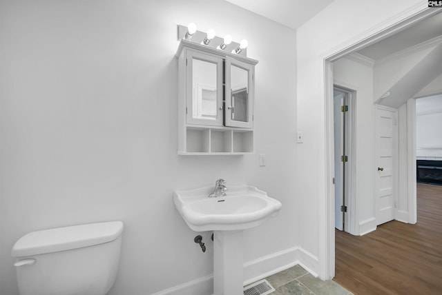 1005 D Ave, West Columbia, SC 29169 - bathroom featuring toilet and baseboards