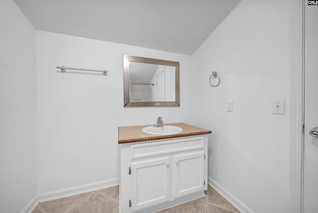 1005 D Ave, West Columbia, SC 29169 - bathroom with vanity, tile patterned flooring, and lofted ceiling