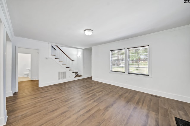 1005 D Ave, West Columbia, SC 29169 - empty room with stairs, wood finished floors, and ornamental molding