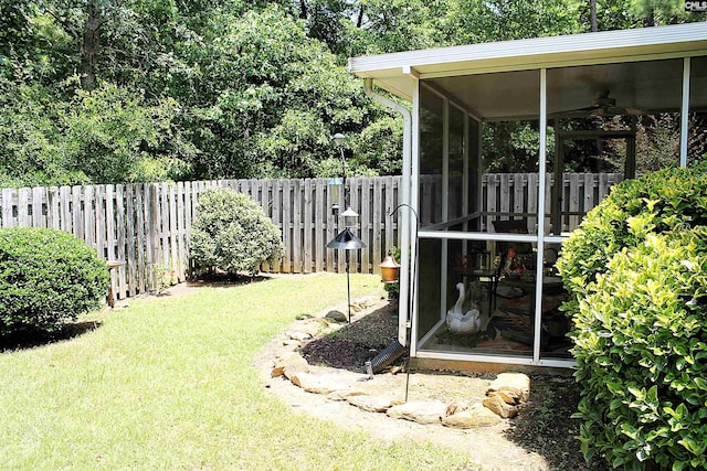 499 Woodhouse Loop, Irmo, SC 29063 - fenced backyard featuring a sunroom and a ceiling fan