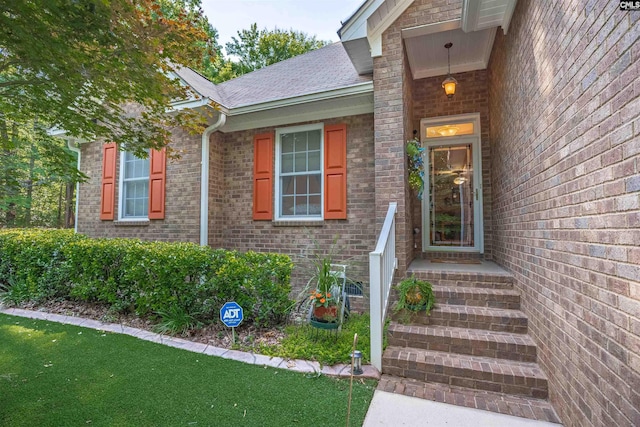 1176 Whippoorwill Rd, Prosperity, SC 29127 - property entrance with brick siding, a shingled roof, and a yard