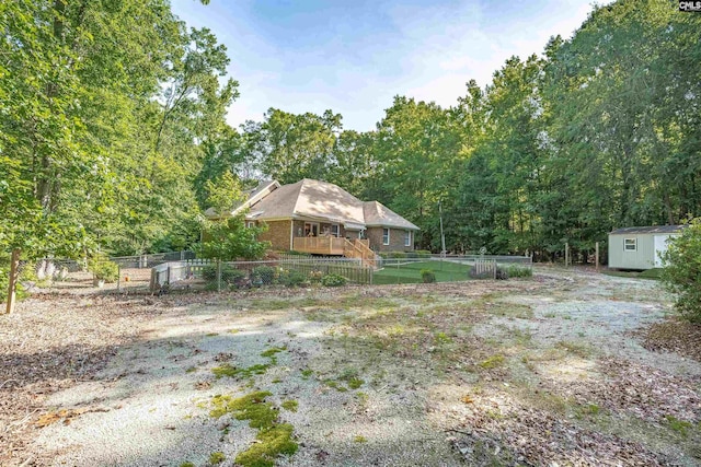 1176 Whippoorwill Rd, Prosperity, SC 29127 - fenced backyard featuring a shed and a view of trees