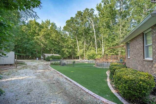 1176 Whippoorwill Rd, Prosperity, SC 29127 - view of yard featuring a storage unit and a wooden deck