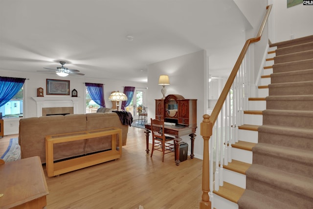 1176 Whippoorwill Rd, Prosperity, SC 29127 - living area with ceiling fan, stairs, plenty of natural light, and light wood-style floors