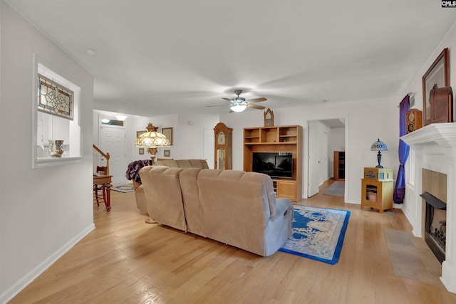 1176 Whippoorwill Rd, Prosperity, SC 29127 - living area with a fireplace with flush hearth, light wood-style floors, and ceiling fan