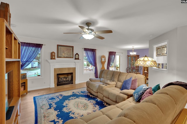 1176 Whippoorwill Rd, Prosperity, SC 29127 - living room with healthy amount of natural light, light wood-style floors, ceiling fan, and a chandelier