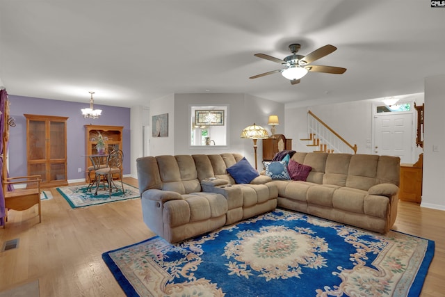 1176 Whippoorwill Rd, Prosperity, SC 29127 - living room with wood finished floors, a chandelier, stairway, and a ceiling fan