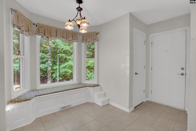 1176 Whippoorwill Rd, Prosperity, SC 29127 - unfurnished dining area with light tile patterned floors and a chandelier