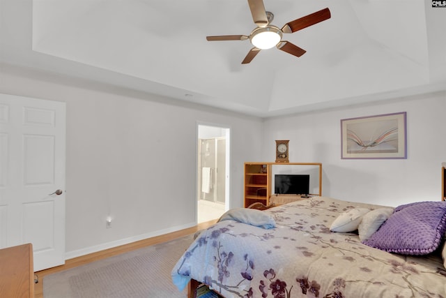 1176 Whippoorwill Rd, Prosperity, SC 29127 - bedroom featuring wood finished floors, a tray ceiling, ceiling fan, and connected bathroom