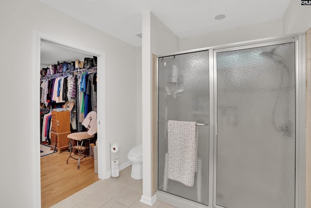 1176 Whippoorwill Rd, Prosperity, SC 29127 - full bathroom featuring a stall shower, a walk in closet, and tile patterned flooring