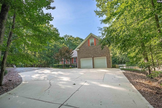 1176 Whippoorwill Rd, Prosperity, SC 29127 - view of side of property with a garage, concrete driveway, and brick siding
