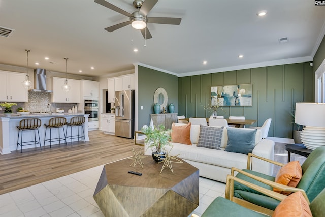 821 Oak Valley Dr, Blythewood, SC 29016 - living area with crown molding, a ceiling fan, recessed lighting, and light wood finished floors