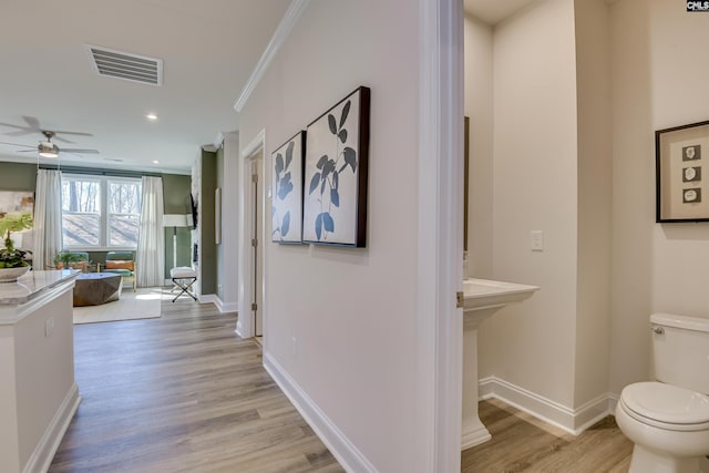 821 Oak Valley Dr, Blythewood, SC 29016 - hallway featuring light wood-type flooring, ornamental molding, and recessed lighting