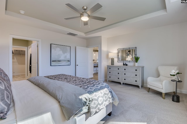 821 Oak Valley Dr, Blythewood, SC 29016 - bedroom with a raised ceiling, light colored carpet, and ceiling fan