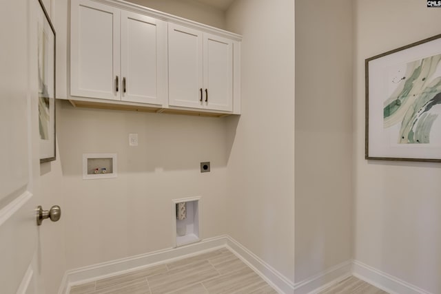 821 Oak Valley Dr, Blythewood, SC 29016 - washroom featuring electric dryer hookup, hookup for a washing machine, and cabinet space
