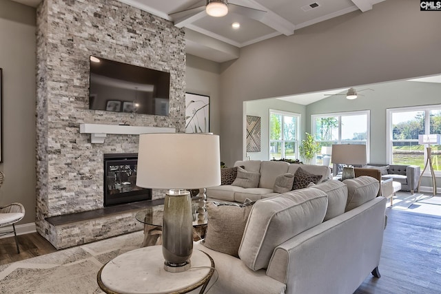793 Oak Valley Dr, Blythewood, SC 29016 - living room featuring a ceiling fan, wood finished floors, beamed ceiling, a fireplace, and crown molding
