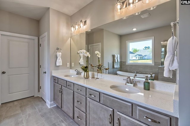 793 Oak Valley Dr, Blythewood, SC 29016 - bathroom featuring a tub to relax in and double vanity