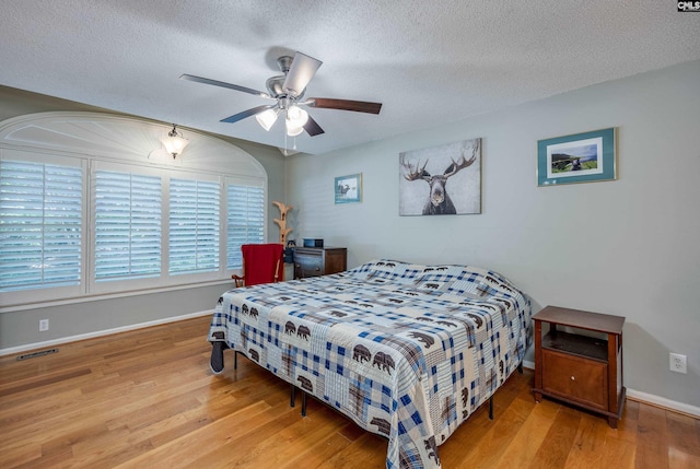 111 Double Branch Ct, West Columbia, SC 29169 - bedroom with wood finished floors, a textured ceiling, and a ceiling fan