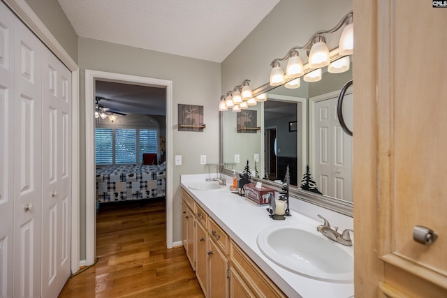 111 Double Branch Ct, West Columbia, SC 29169 - ensuite bathroom with a closet, double vanity, wood finished floors, ceiling fan, and a textured ceiling
