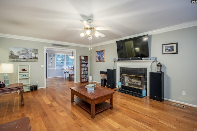 111 Double Branch Ct, West Columbia, SC 29169 - living area featuring a ceiling fan, crown molding, light wood-style floors, and a tile fireplace
