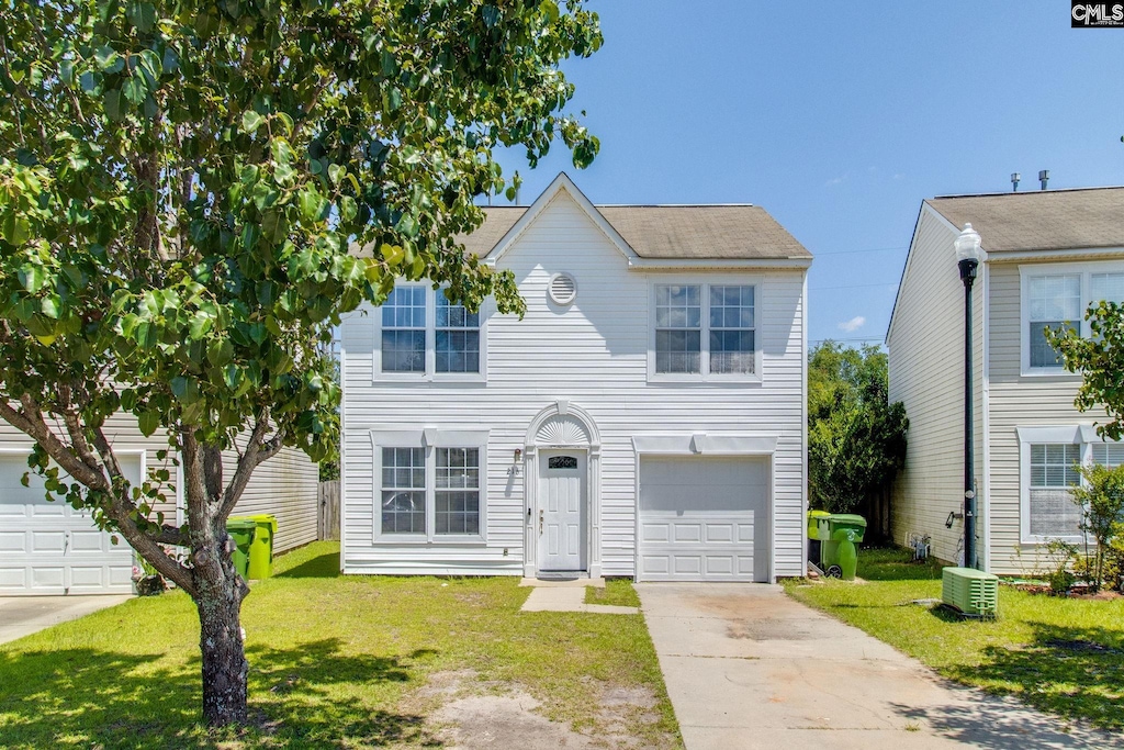 216 Curvewood Rd, Columbia, SC 29229 - view of front of home featuring driveway, a front lawn, and a garage