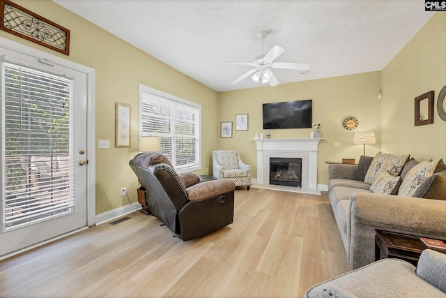 113 Chalfont Ln, Columbia, SC 29229 - living room featuring light wood-type flooring, a ceiling fan, and a glass covered fireplace