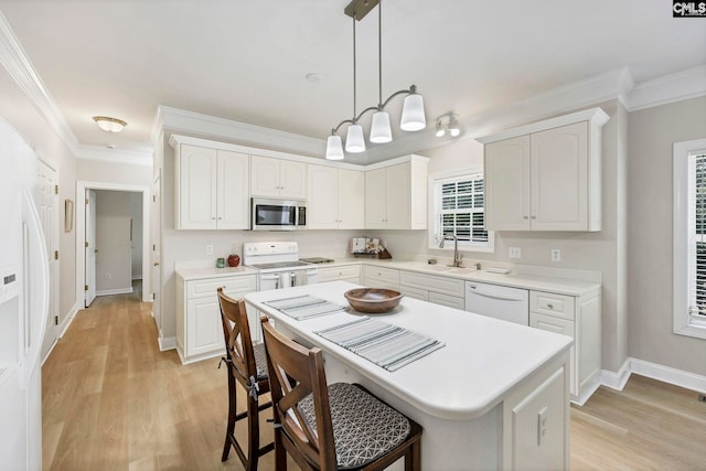 113 Chalfont Ln, Columbia, SC 29229 - kitchen featuring white appliances, crown molding, white cabinets, decorative light fixtures, and light wood-style flooring