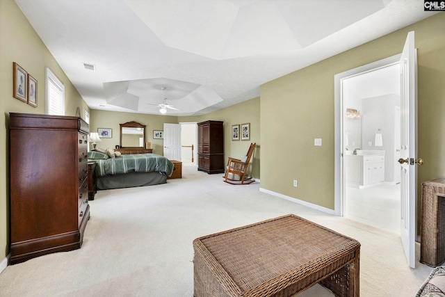 113 Chalfont Ln, Columbia, SC 29229 - bedroom featuring a raised ceiling, light colored carpet, connected bathroom, and ceiling fan
