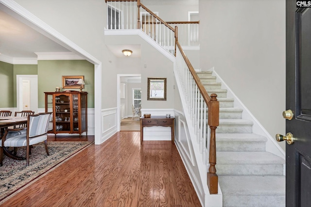 113 Chalfont Ln, Columbia, SC 29229 - entryway with stairway, wood finished floors, a wainscoted wall, and ornamental molding