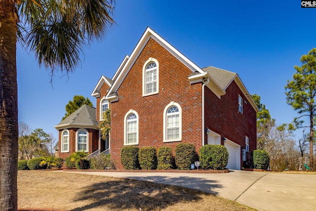 340 Heritage Forest Dr, Blythewood, SC 29045 - view of front of home featuring brick siding, driveway, and an attached garage
