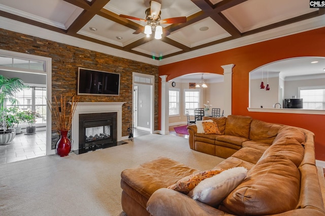 340 Heritage Forest Dr, Blythewood, SC 29045 - living area with arched walkways, healthy amount of natural light, a chandelier, beam ceiling, and crown molding