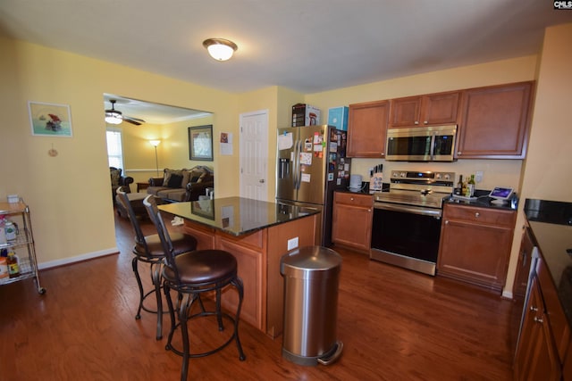 458 Laurel Mist Ln, West Columbia, SC 29170 - kitchen with stainless steel appliances, dark wood-type flooring, a kitchen breakfast bar, and open floor plan
