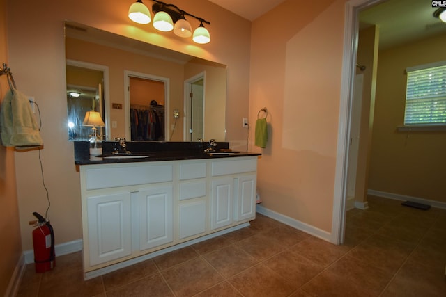 458 Laurel Mist Ln, West Columbia, SC 29170 - full bath featuring double vanity, a walk in closet, and tile patterned flooring