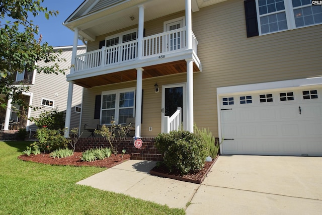 458 Laurel Mist Ln, West Columbia, SC 29170 - view of front of home featuring covered porch, an attached garage, a balcony, a front lawn, and concrete driveway