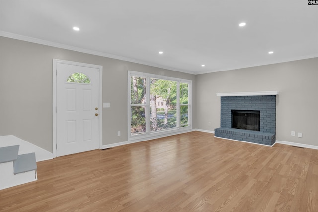 2 Westpine Ct, Columbia, SC 29212 - unfurnished living room with ornamental molding, healthy amount of natural light, light wood-style flooring, recessed lighting, and a brick fireplace