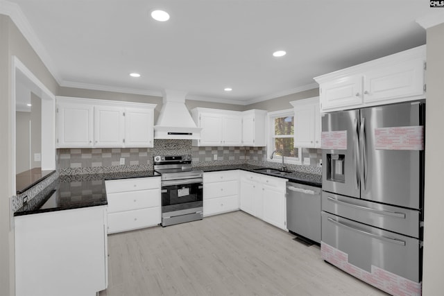 2 Westpine Ct, Columbia, SC 29212 - kitchen with stainless steel appliances, custom exhaust hood, white cabinets, crown molding, and tasteful backsplash