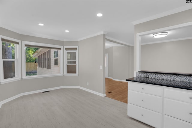 2 Westpine Ct, Columbia, SC 29212 - kitchen featuring light wood-style floors, ornamental molding, white cabinetry, dark countertops, and recessed lighting