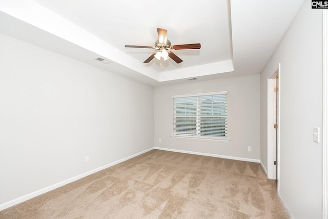 779 Dawsons Park Way, Lexington, SC 29072 - empty room featuring ceiling fan, a raised ceiling, and light carpet