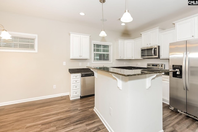 779 Dawsons Park Way, Lexington, SC 29072 - kitchen with stainless steel appliances, a kitchen breakfast bar, white cabinets, dark wood-style flooring, and recessed lighting