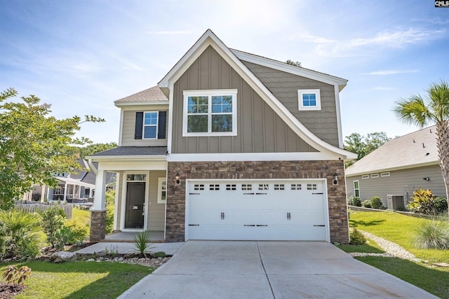 386 Amalfi Dr, Chapin, SC 29036 - craftsman-style house featuring stone siding, board and batten siding, driveway, a front yard, and an attached garage