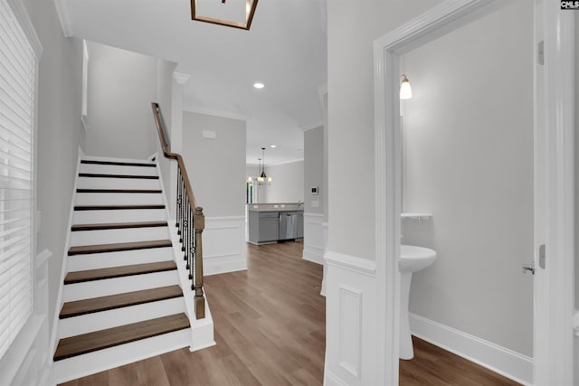 386 Amalfi Dr, Chapin, SC 29036 - stairway with wood finished floors, ornamental molding, and recessed lighting