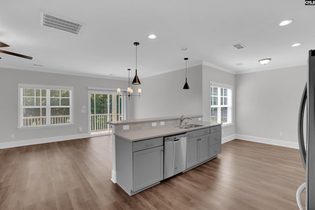 386 Amalfi Dr, Chapin, SC 29036 - kitchen with appliances with stainless steel finishes, open floor plan, ceiling fan, ornamental molding, and wood finished floors
