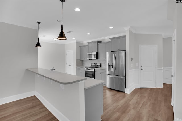 386 Amalfi Dr, Chapin, SC 29036 - kitchen with stainless steel appliances, gray cabinets, light wood-type flooring, light countertops, and backsplash